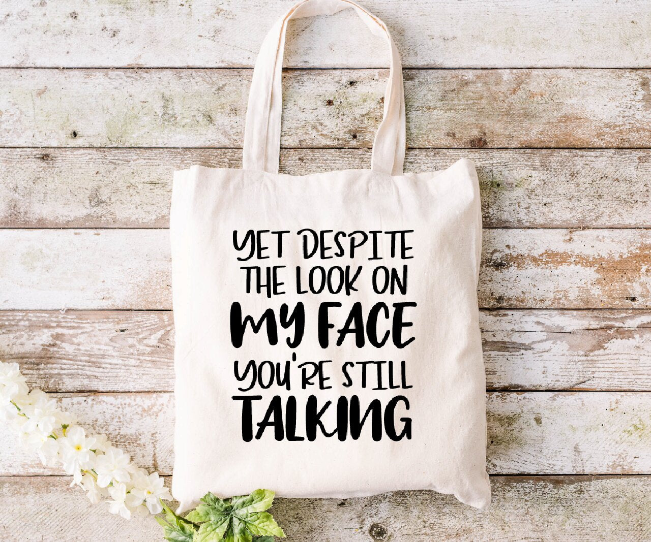 Yet Despite The Look On My Face, You're Still Talking- Tote Bag